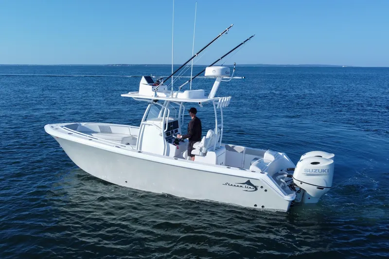 Slide: The Image of 2019 Streamline 26 TE boat with Suzuki engine on calm ocean waters. - 12