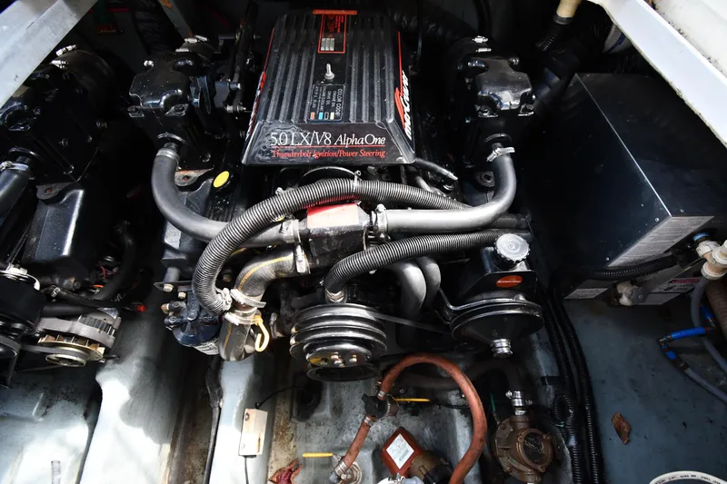 Slide: The Image of Engine compartment of a 1993 Sea Ray 300 Sundancer with 5.0L V8 Alpha One engine. - 36