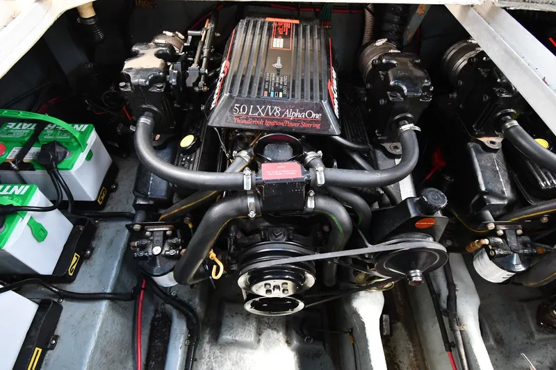 Slide: The Image of Engine compartment of a 1993 Sea Ray 300 Sundancer with batteries and V8 engine. - 37