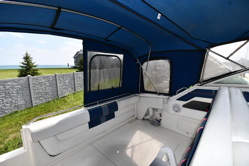 Slide: The Image of Interior view of 1993 Sea Ray 300 Sundancer boat with blue canopy. - 16