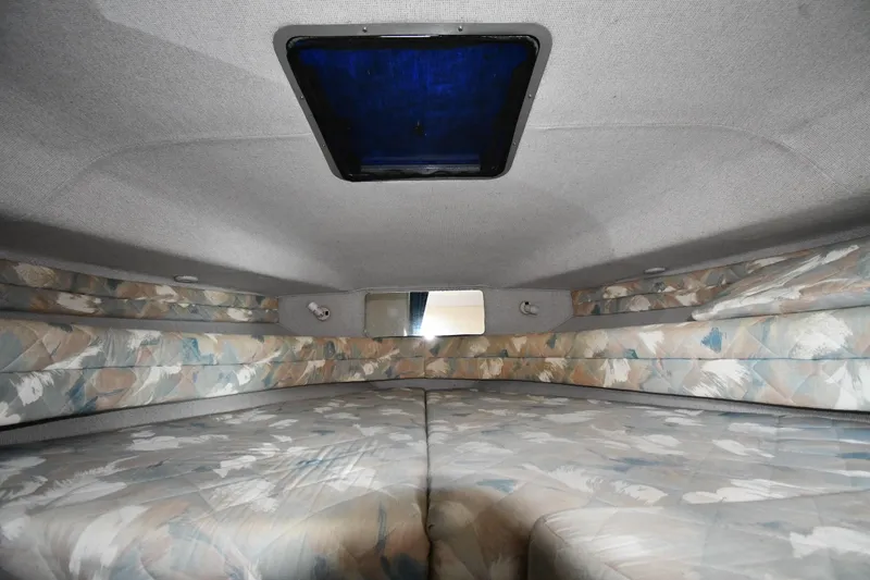 Slide: The Image of Interior cabin of 1993 Sea Ray 300 Sundancer with patterned upholstery and overhead hatch. - 19