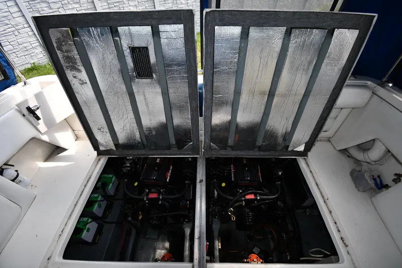 Slide: The Image of Engine compartment of a 1993 Sea Ray 300 Sundancer boat, showcasing dual engines. - 35