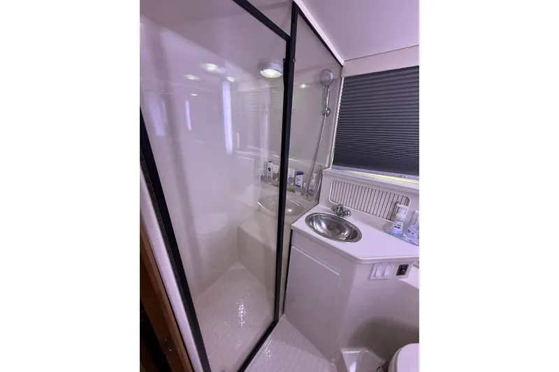 Slide: The Image of Bathroom interior of 1992 Carver 33 Aft Cabin Motor Yacht with shower and sink. - 46