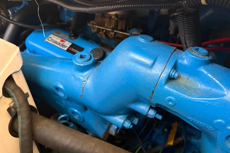 Slide: The Image of Close-up of a blue Crusader engine in a 1992 Carver 33 Aft Cabin Motor Yacht. - 52