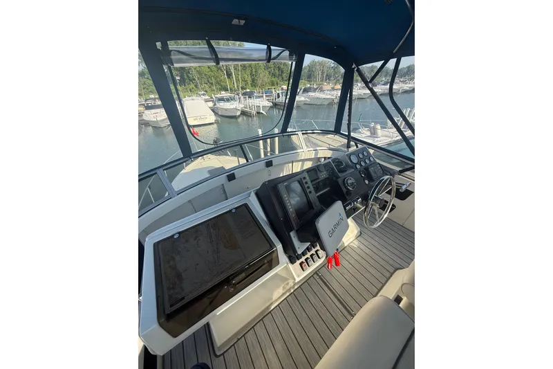 Slide: The Image of Helm of 1992 Carver 33 Aft Cabin Motor Yacht with Garmin navigation system. - 23