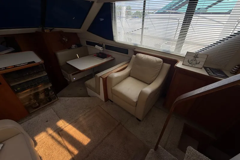 Slide: The Image of Interior of 1992 Carver 33 Aft Cabin Motor Yacht with cozy seating and table. - 29
