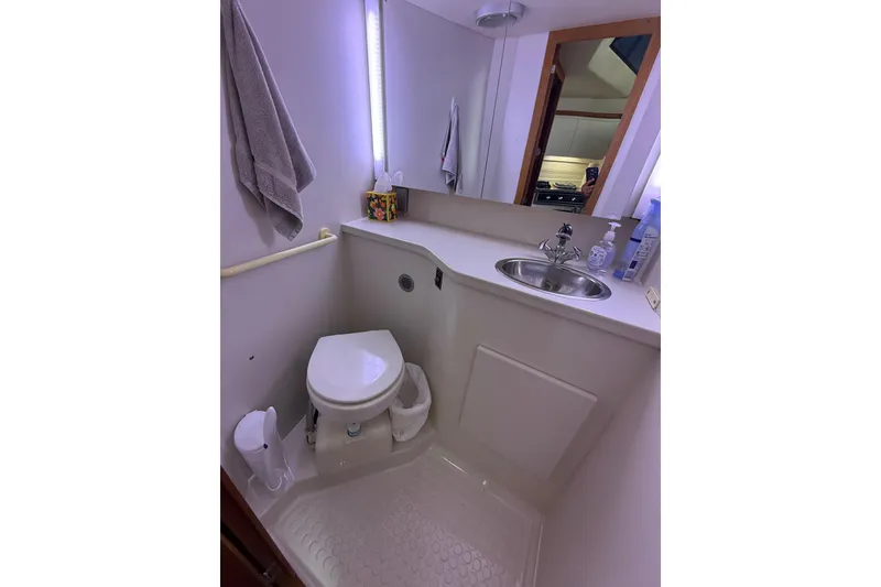 Slide: The Image of Bathroom interior of 1992 Carver 33 Aft Cabin Motor Yacht with sink and toilet. - 41