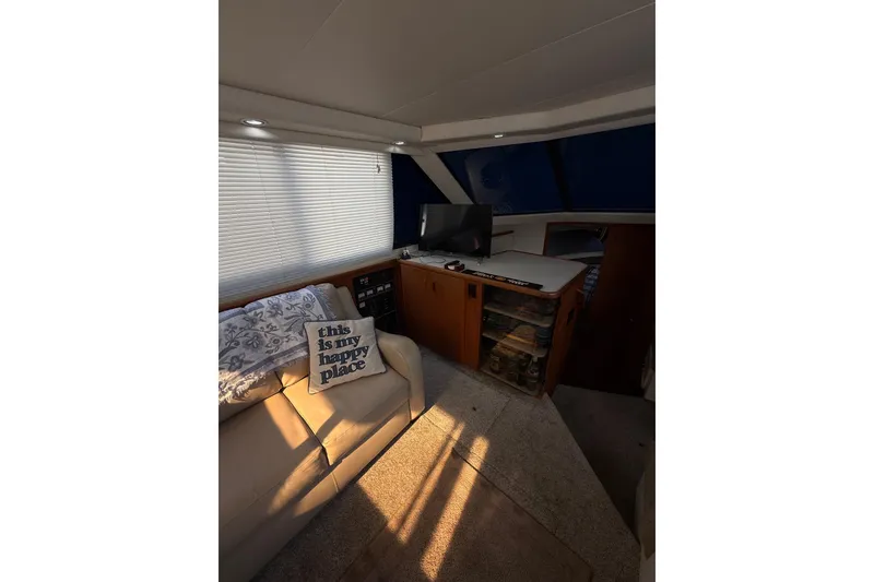 Slide: The Image of Interior of 1992 Carver 33 Aft Cabin Motor Yacht with cozy seating and decor. - 28