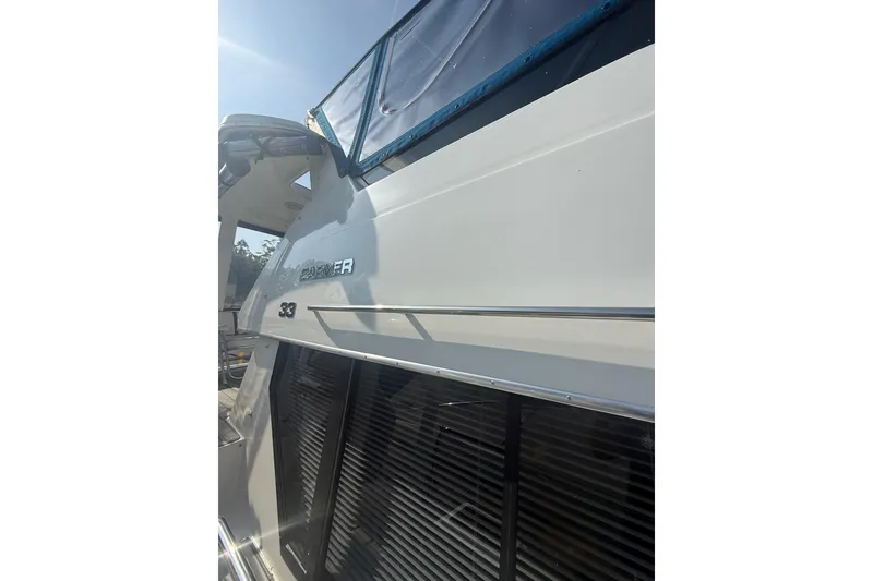 Slide: The Image of 1992 Carver 33 Aft Cabin Motor Yacht, side view with sleek design and windows. - 3