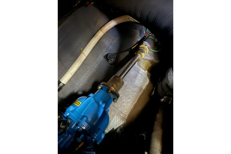 Slide: The Image of Engine room of 1992 Carver 33 Aft Cabin Motor Yacht, showing mechanical components. - 56