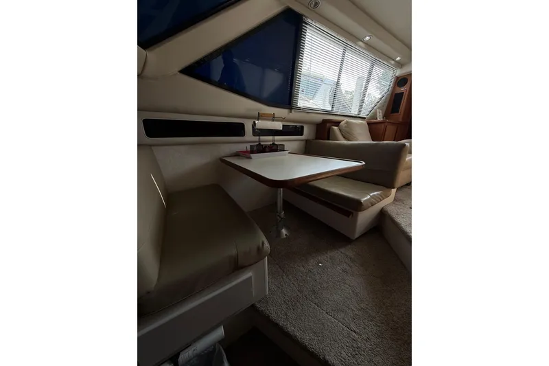 Slide: The Image of Interior of 1992 Carver 33 Aft Cabin Motor Yacht with seating and table. - 34