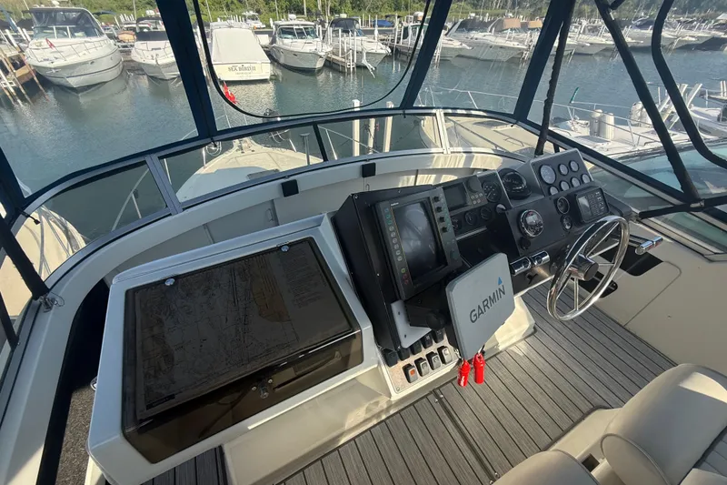 Slide: The Image of Cockpit view of 1992 Carver 33 Aft Cabin Motor Yacht with Garmin navigation system. - 21