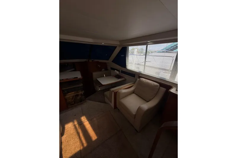 Slide: The Image of Interior of 1992 Carver 33 Aft Cabin Motor Yacht with seating and table. - 27