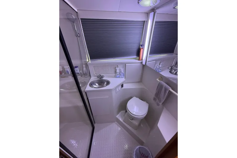 Slide: The Image of Bathroom interior of 1992 Carver 33 Aft Cabin Motor Yacht, featuring sink and toilet. - 47