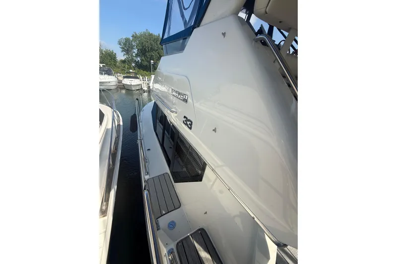 Slide: The Image of 1992 Carver 33 Aft Cabin Motor Yacht docked at marina, side view. - 15
