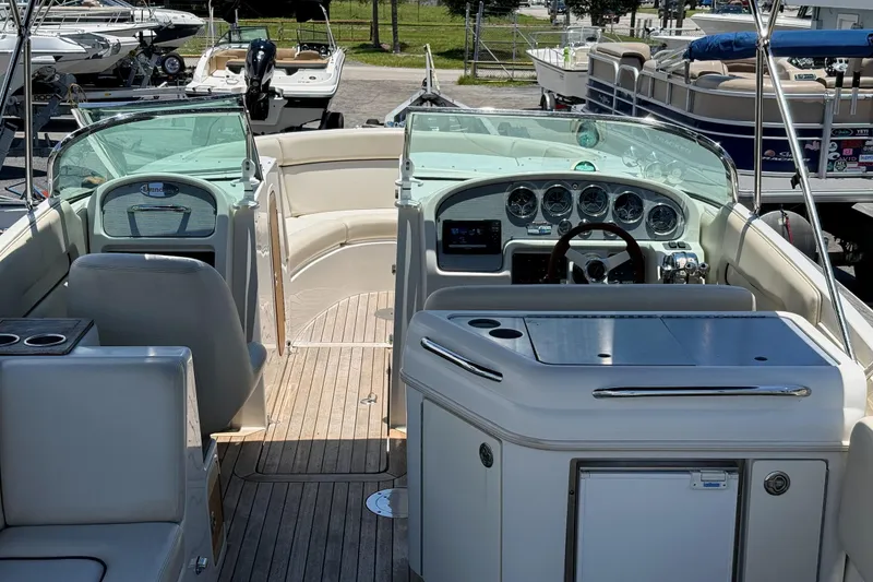Slide: The Image of 2005 Chris-Craft Launch 28 boat interior with dashboard and seating area. - 7