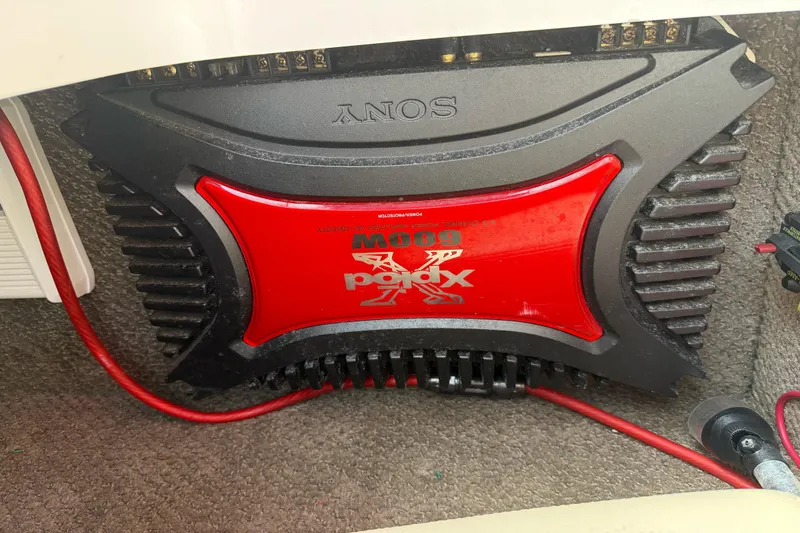 Slide: The Image of Sony amplifier installed in a 2005 Chris-Craft Launch 28 boat, featuring red and black design. - 30