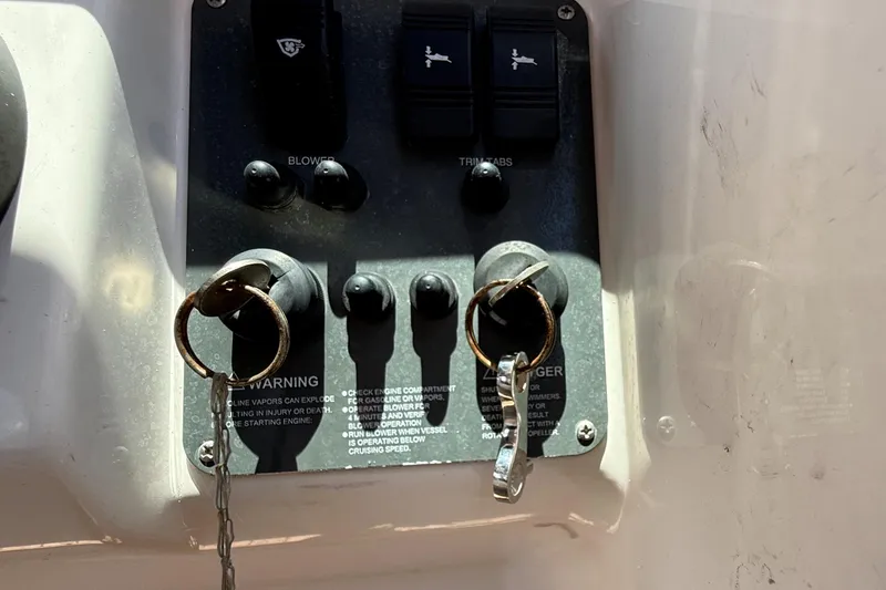 Slide: The Image of Control panel of a 2005 Chris-Craft Launch 28 boat with ignition keys inserted. - 15