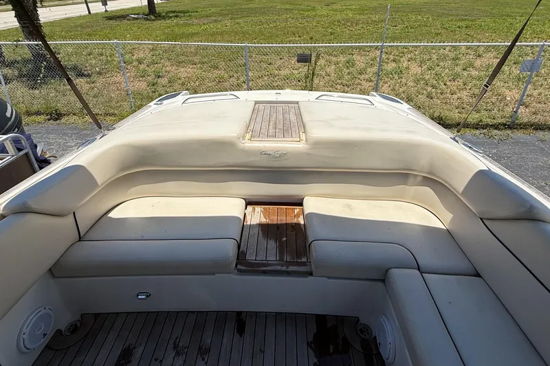 Slide: The Image of 2005 Chris-Craft Launch 28 boat interior with beige seating and wooden flooring. - 40