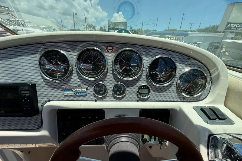 Slide: The Image of Dashboard of a 2005 Chris-Craft Launch 28 boat with gauges and controls. - 13