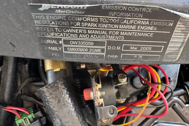 Slide: The Image of Engine label of a 2005 Chris-Craft Launch 28, showing emission control information. - 48