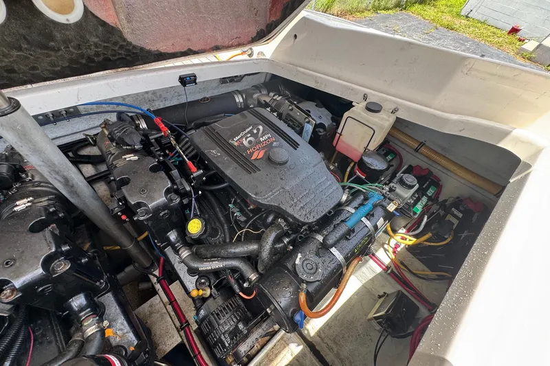 Slide: The Image of Engine compartment of a 2005 Chris-Craft Launch 28 boat, featuring a MerCruiser 6.2 MPI engine. - 46