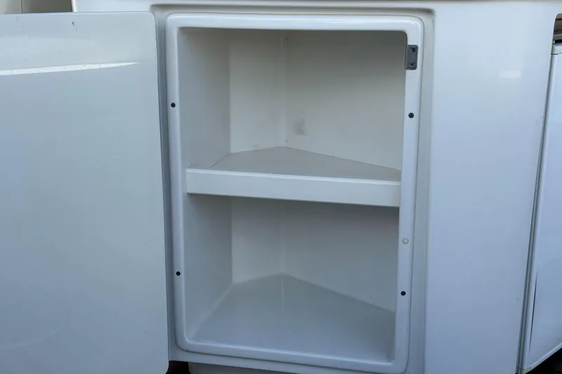 Slide: The Image of Open storage compartment on a 2005 Chris-Craft Launch 28 boat. - 35