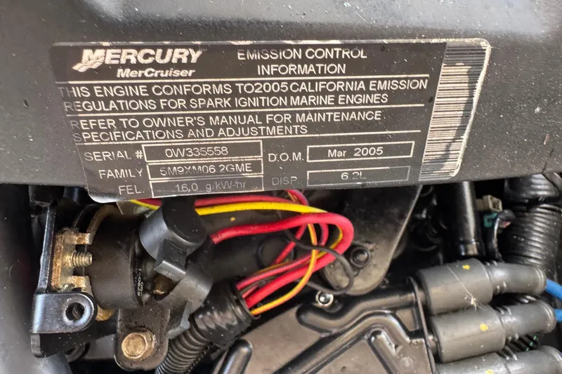 Slide: The Image of Mercury MerCruiser engine label on 2005 Chris-Craft Launch 28, showing emission control information. - 47