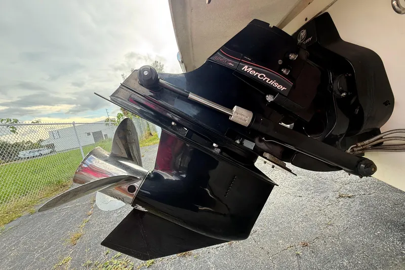 Slide: The Image of MerCruiser engine on a 2005 Chris-Craft Launch 28 boat, parked outdoors. - 52
