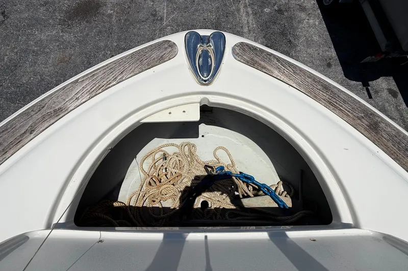 Slide: The Image of Bow storage compartment of 2005 Chris-Craft Launch 28 with ropes and anchor. - 27