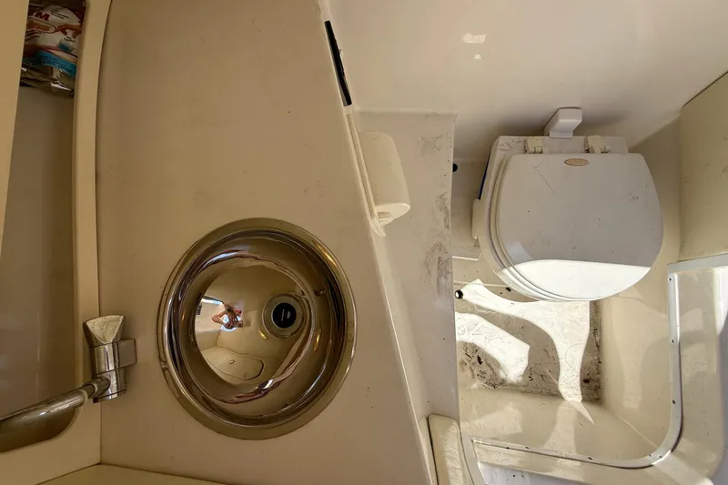 Slide: The Image of 2005 Chris-Craft Launch 28 boat bathroom with sink and toilet. - 25