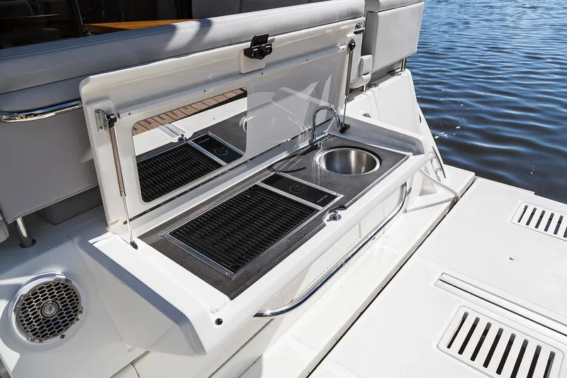 Slide: The Image of Manufacturer Provided Image: Outdoor kitchen on 2018 Sea Ray Fly 460 yacht with sink and grill. - 4