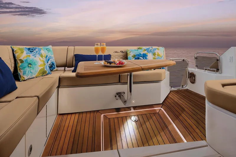 Slide: The Image of Manufacturer Provided Image: Luxurious 2018 Sea Ray Fly 460 yacht deck with sunset view, wooden flooring, and elegant seating. - 6