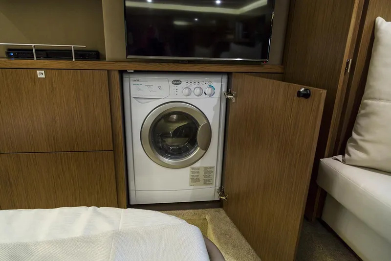 Slide: The Image of Manufacturer Provided Image: Built-in washing machine in 2018 Sea Ray Fly 460 yacht interior. - 12