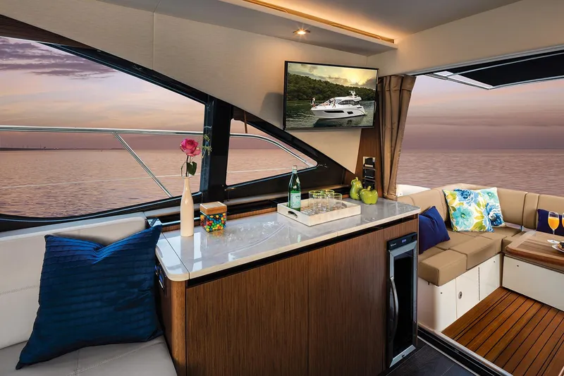 Slide: The Image of Manufacturer Provided Image: Luxurious interior of 2018 Sea Ray Fly 460 yacht with ocean view at sunset. - 7