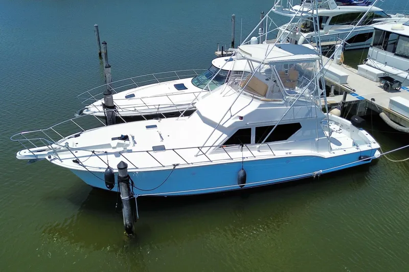 Slide: The Image of 1990 Hatteras 45 Convertible yacht docked in marina, aerial view. - 6