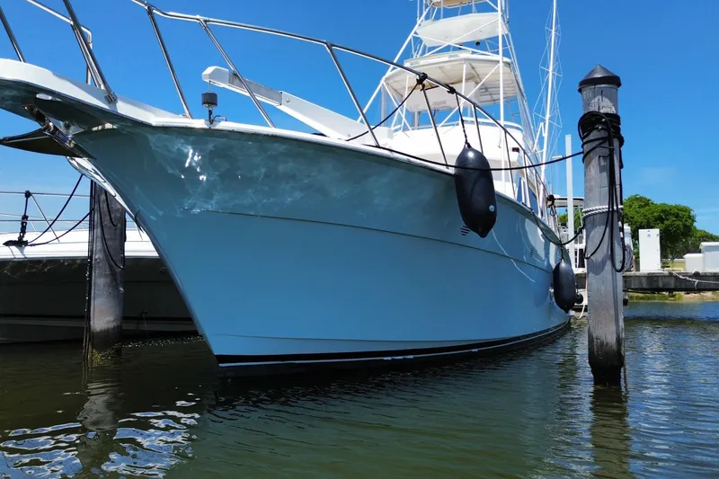 Slide: The Image of 1990 Hatteras 45 Convertible yacht docked, featuring sleek design and sturdy build. - 15