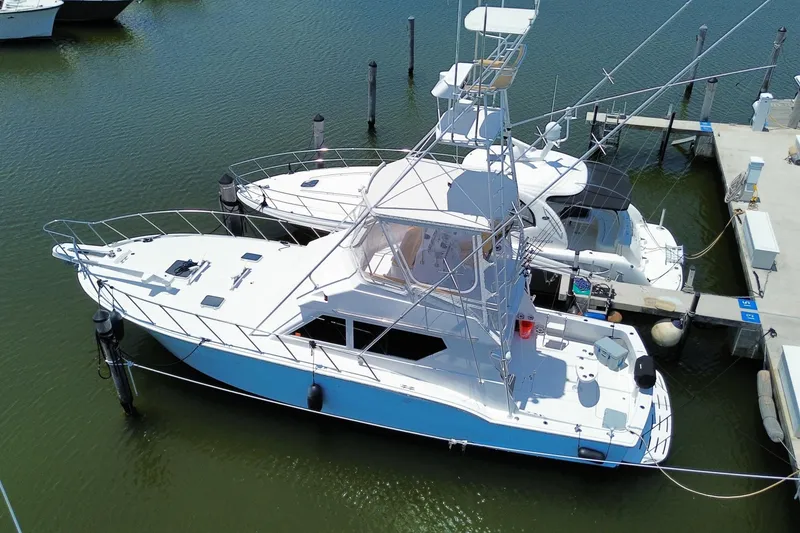Slide: The Image of 1990 Hatteras 45 Convertible yacht docked in marina, aerial view. - 8