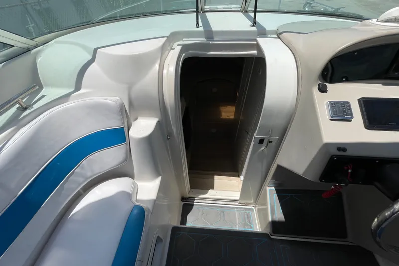 Slide: The Image of Interior view of a 2000 Rinker 280 Express Cruiser, showing cabin entrance and seating. - 40