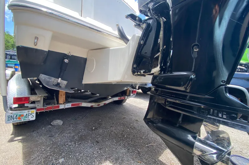 Slide: The Image of 2000 Rinker 280 Express Cruiser on trailer, rear view with outboard motor. - 56