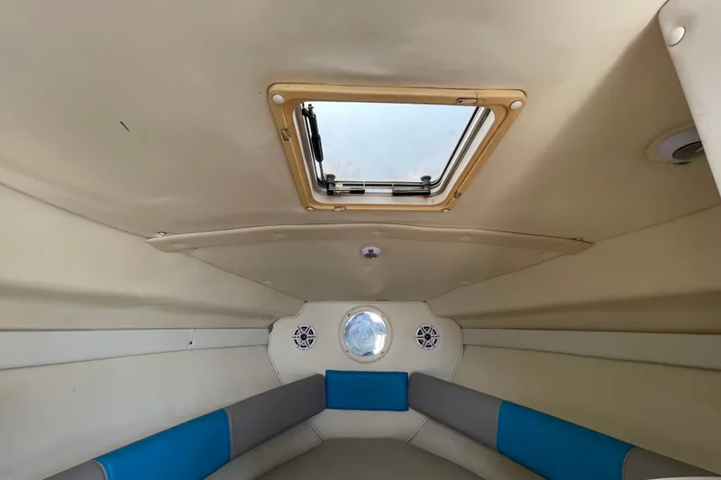 Slide: The Image of Interior cabin of a 2000 Rinker 280 Express Cruiser with skylight and seating. - 46