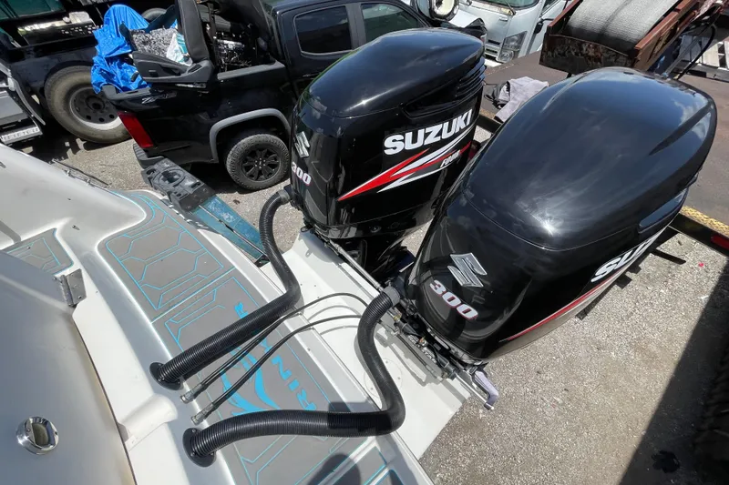 Slide: The Image of Twin Suzuki 300 outboard motors on a 2000 Rinker 280 Express Cruiser. - 30