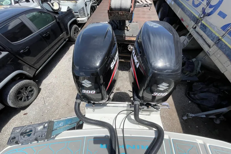 Slide: The Image of Twin Suzuki 300 outboard engines on a 2000 Rinker 280 Express Cruiser. - 29