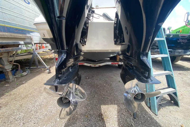 Slide: The Image of Rear view of a 2000 Rinker 280 Express Cruiser with dual propellers. - 51