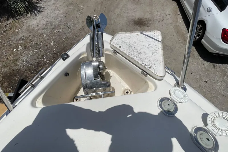 Slide: The Image of Bow of a Rinker 280 Express Cruiser with anchor windlass and storage compartment. - 25