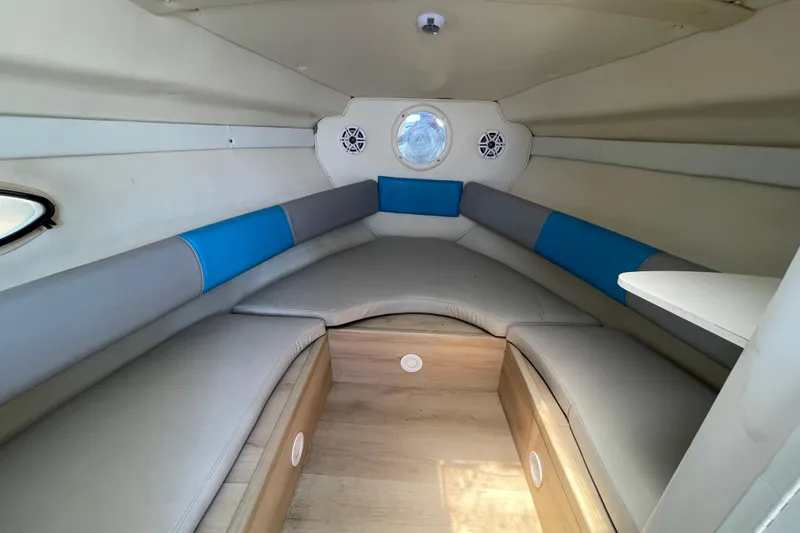 Slide: The Image of Interior of 2000 Rinker 280 Express Cruiser with cozy seating and modern design. - 45