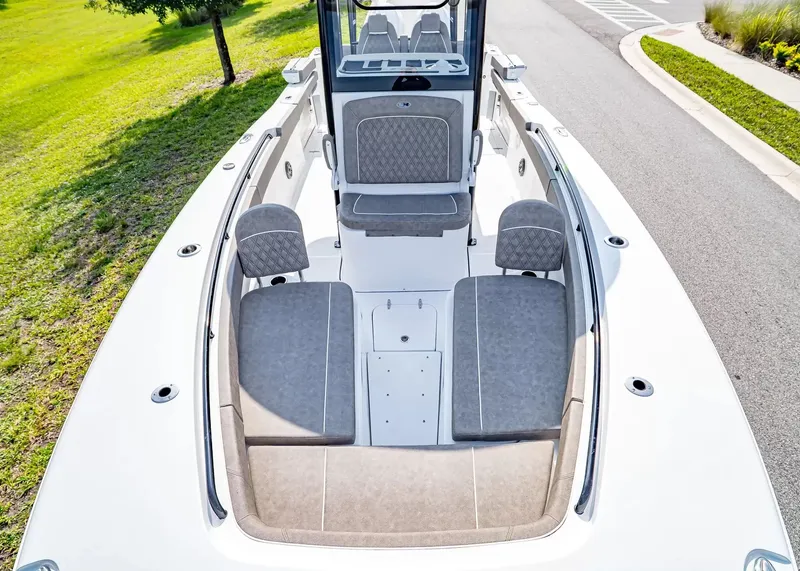 Slide: The Image of The image shows the deck of a 2027 Sea Hunt Ultra 285 SE boat with gray upholstery. - 22