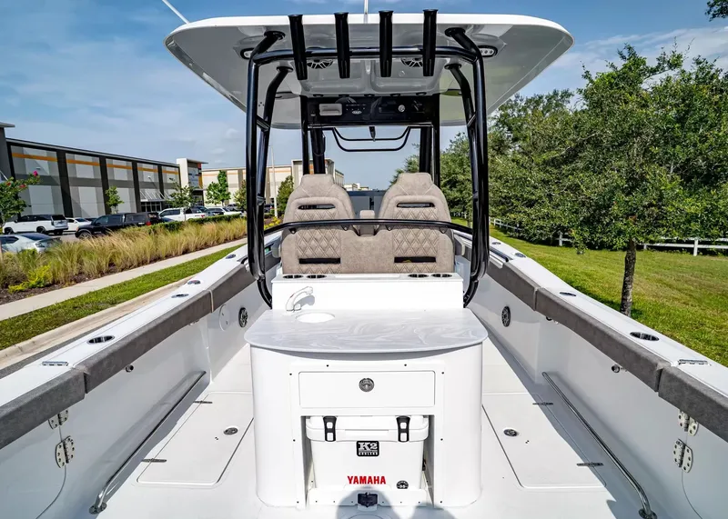 Slide: The Image of The image shows a 2027 Sea Hunt Ultra 285 SE boat with modern seating and a Yamaha engine. - 8