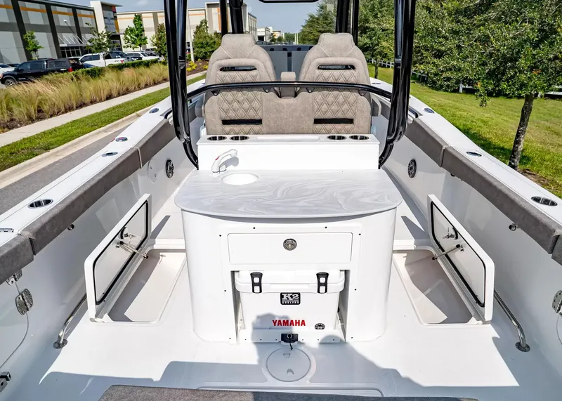 Slide: The Image of The image shows the cockpit of a 2027 Sea Hunt Ultra 285 SE boat. - 12
