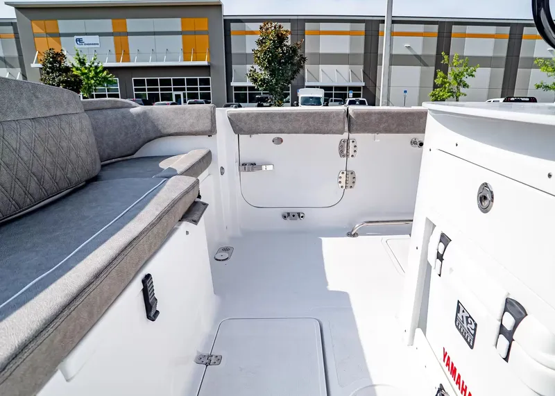 Slide: The Image of Interior view of a modern boat with gray upholstery and white surfaces. - 7